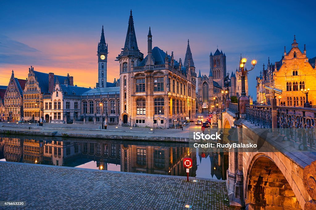 image of ghent, belgium during twilight blue hour.