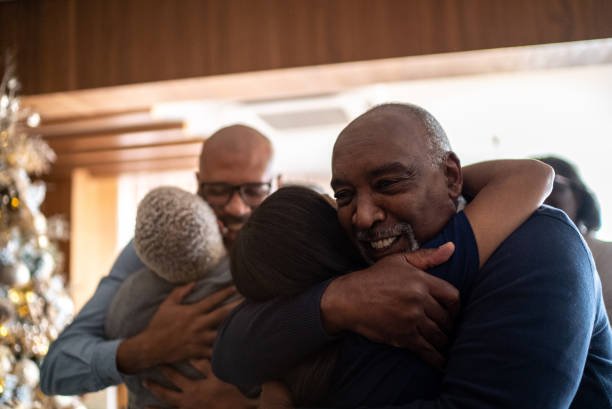 family embracing during christmas at home